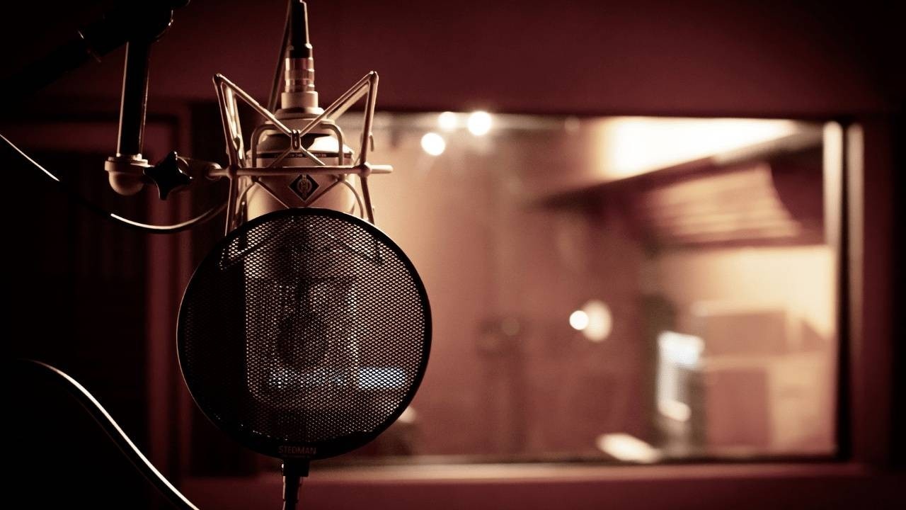 Vocal mic in a recording studio isolation booth