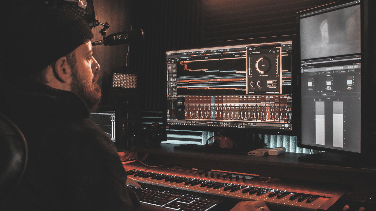 A musician mixing songs with a daw