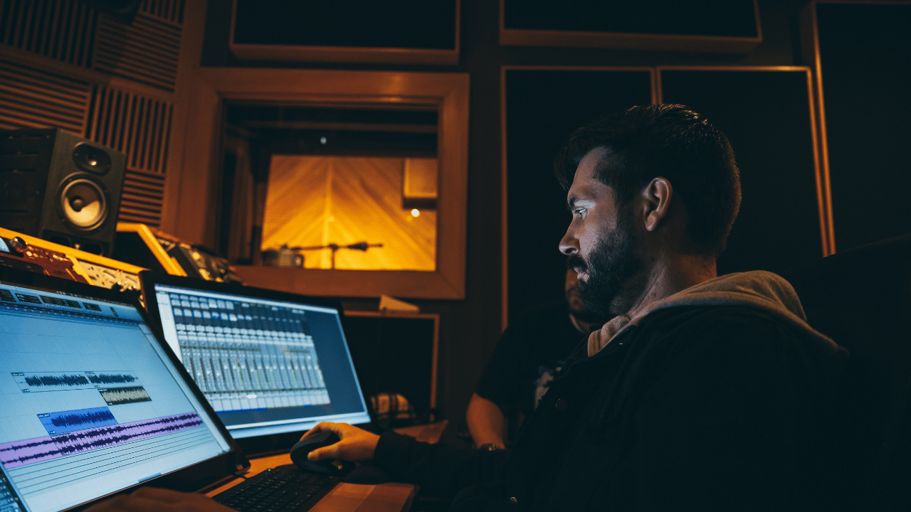 A music producer tries to get loud and clear mixes in a DAW