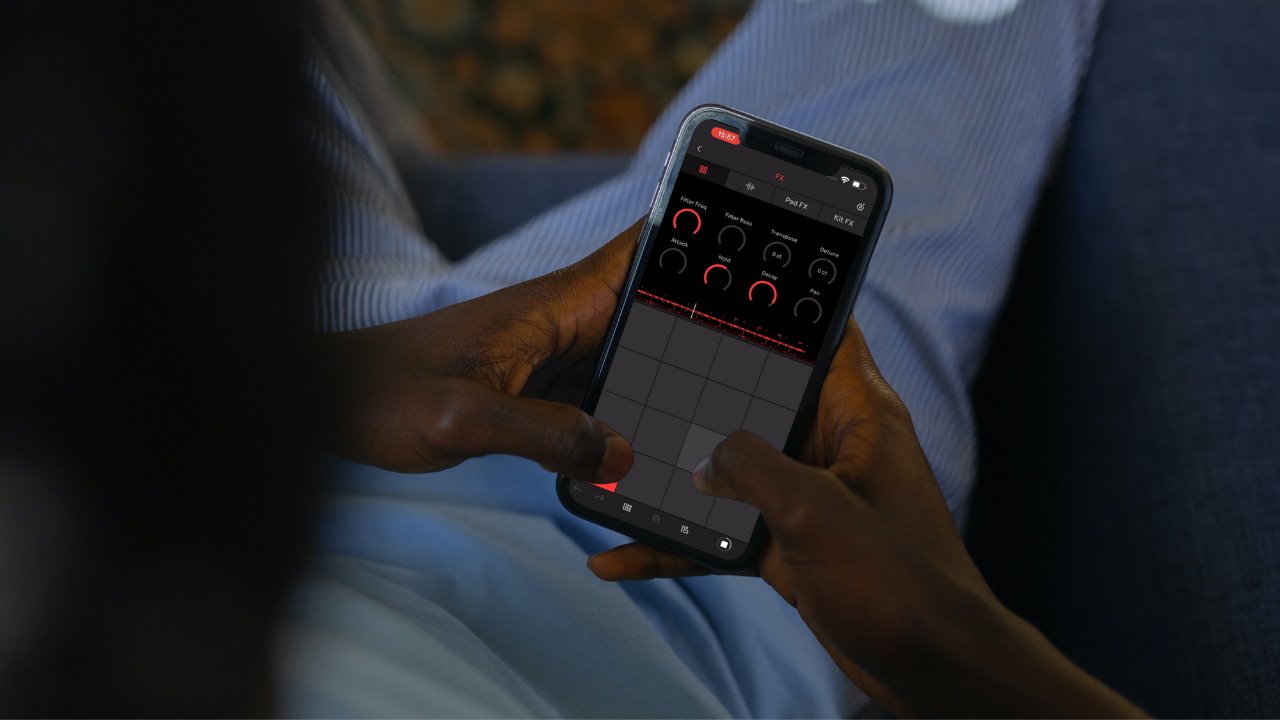 Music producer making a beat on an iPhone with Ableton Note